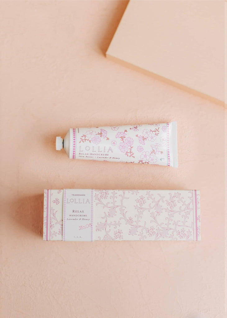 lollia relax handcreme on a pink background