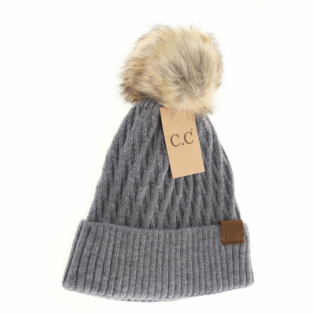 solid honey comb fur pom cc beanie on a white background