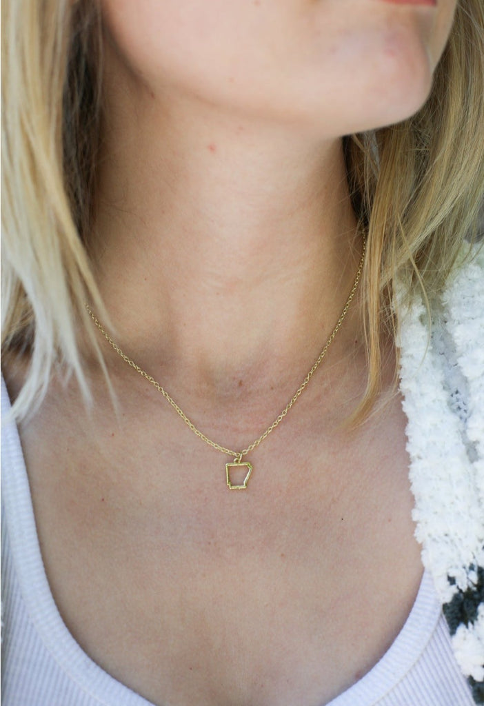 Lucky Feather Oh so natural Arkansas gold necklace on a white background