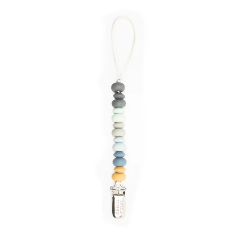 Bella tunno blue multi pacifier clip on a white background