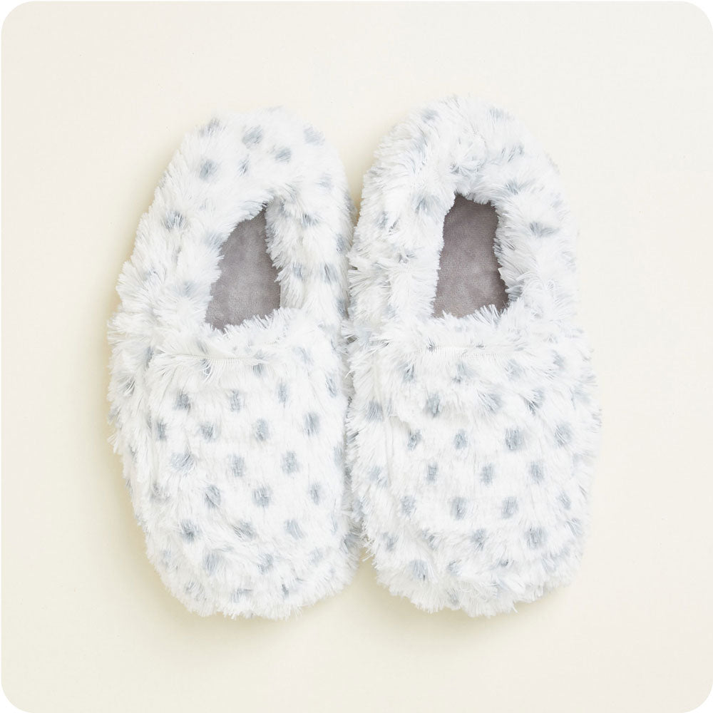 warmies snowy slippers on a cream background