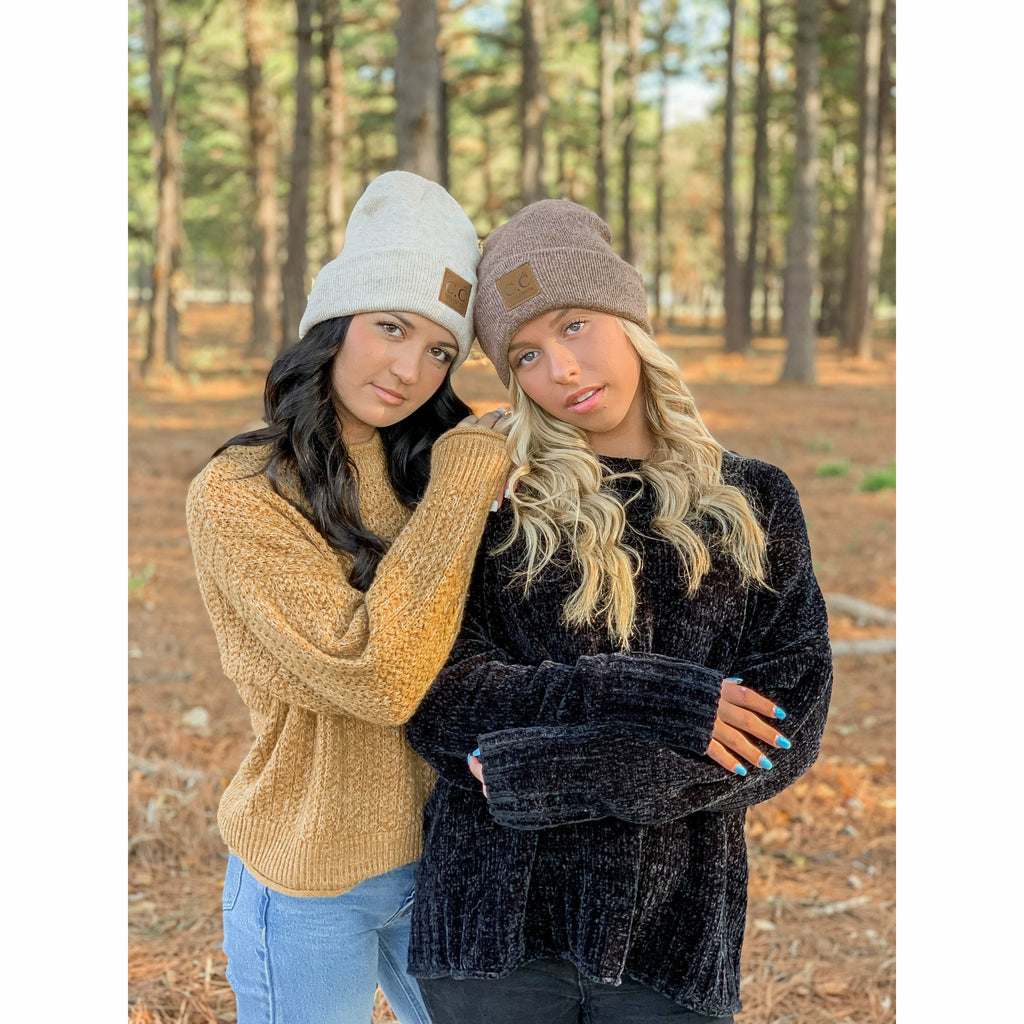 girls wearing soft ribbed leather patch cc beanies in the woods