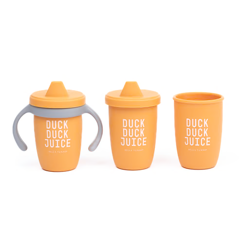 Three orange cups with 'Duck Duck Juice' text on a white background