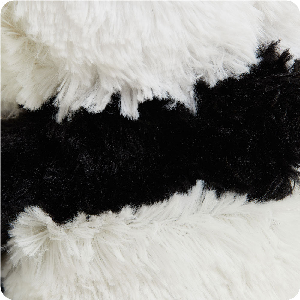 warmies panda on a cream background