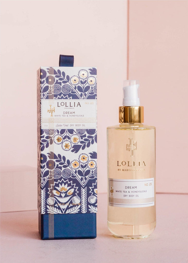lollia dream body oil on a pink background