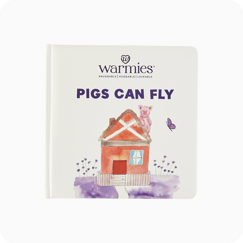 warmies pigs can fly book on a white background