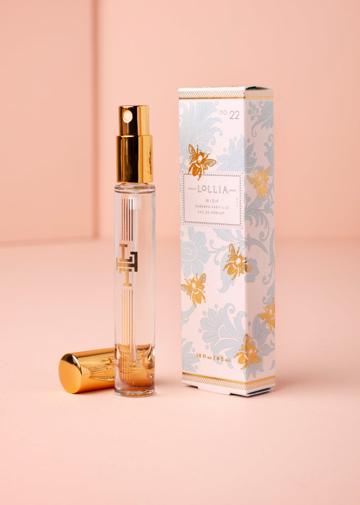 lollia wish perfume on a pink background