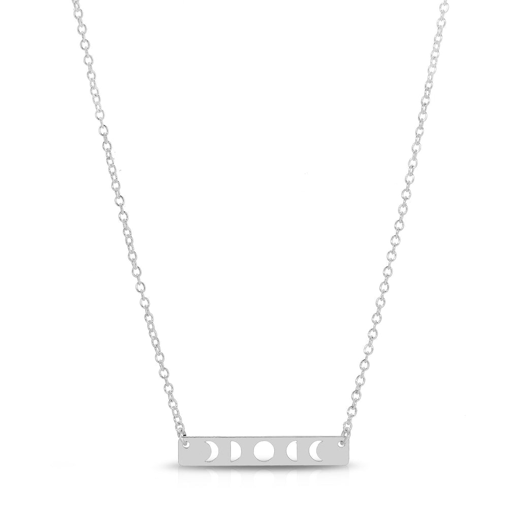 silver moon phase necklace on a white background