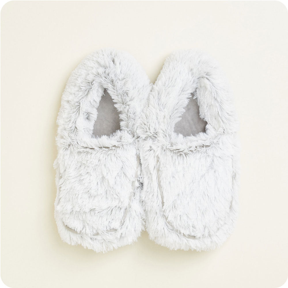 warmies gray warmies slippers on a cream background