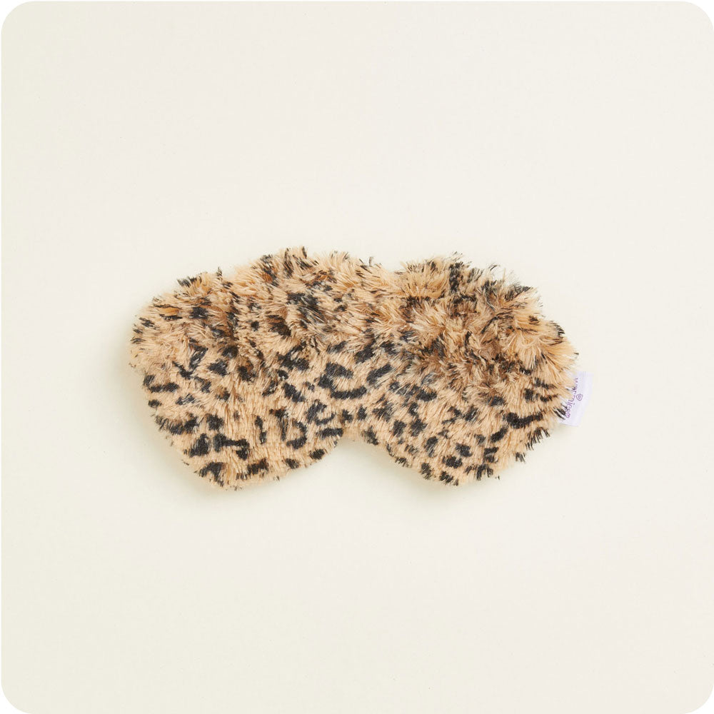 warmies leopard eyemask on a cream background