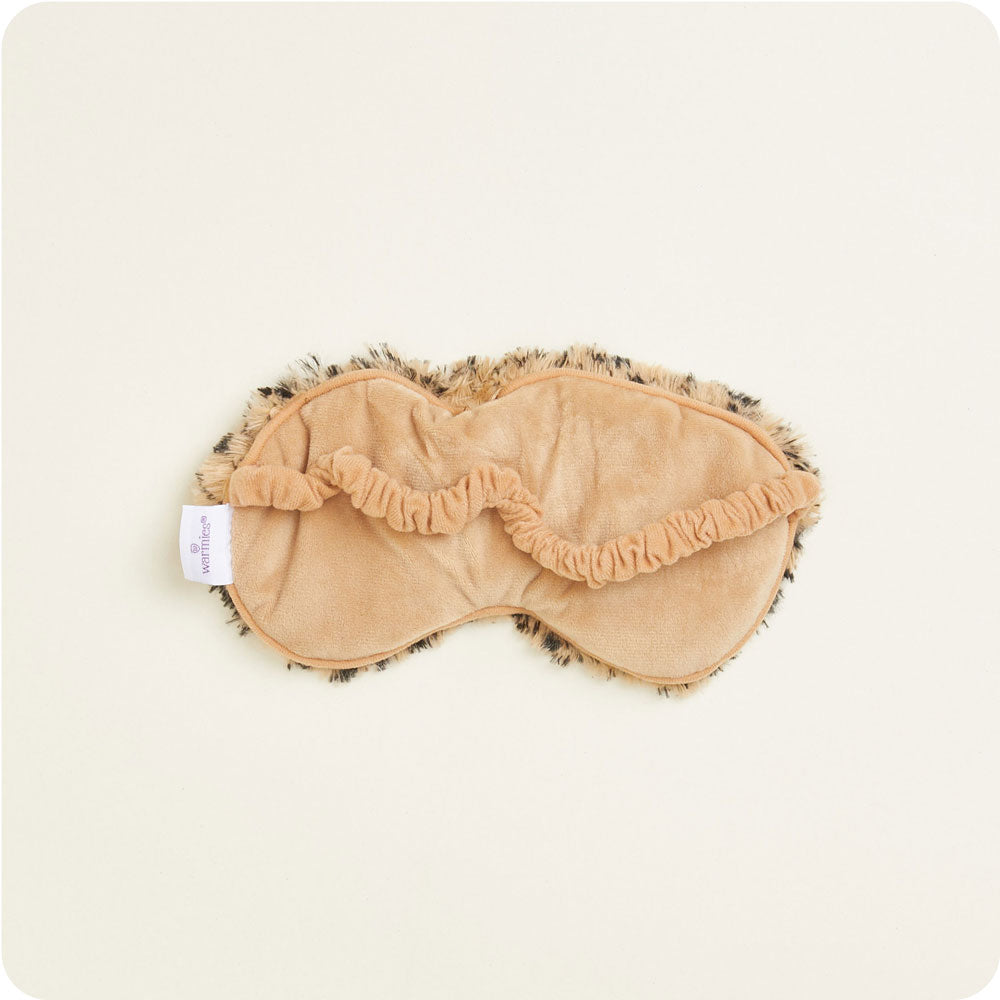 warmies leopard eyemask on a cream background