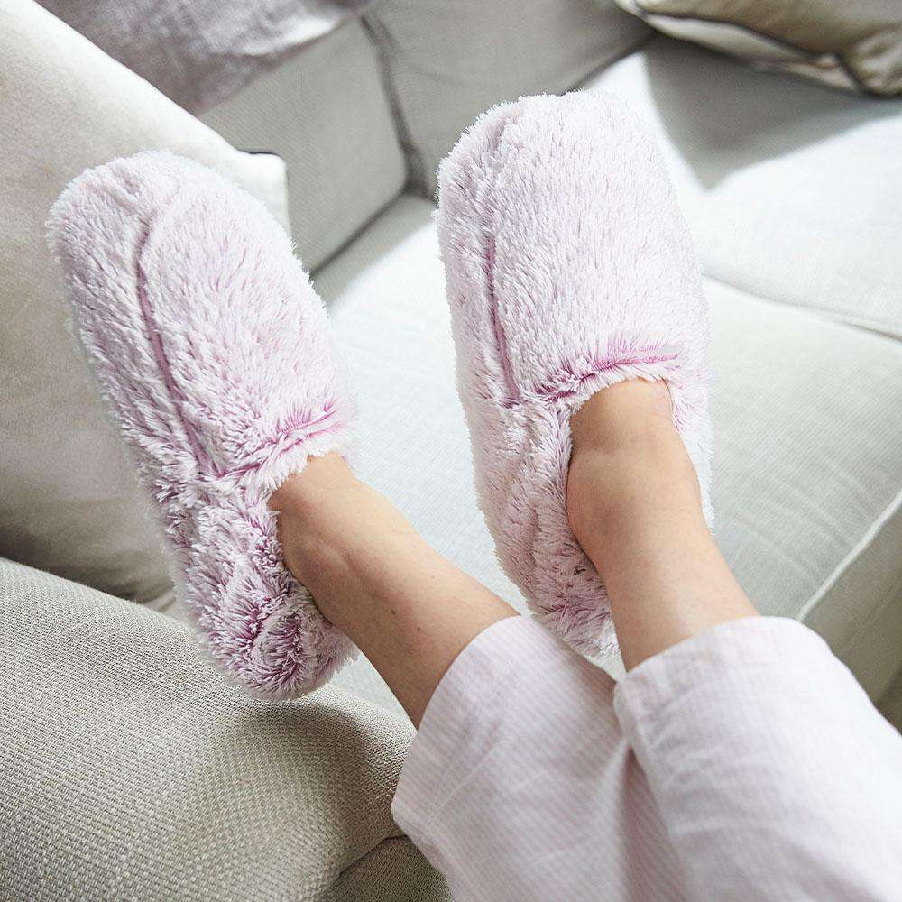 warmies marshmallow lavender slippers on a cream background