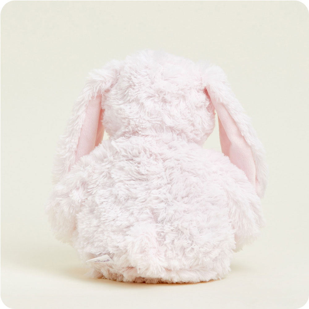 warmies pink bunny on a cream background