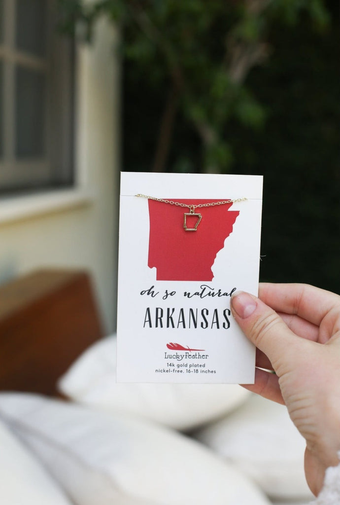 Lucky Feather Oh so natural Arkansas gold necklace on a white background