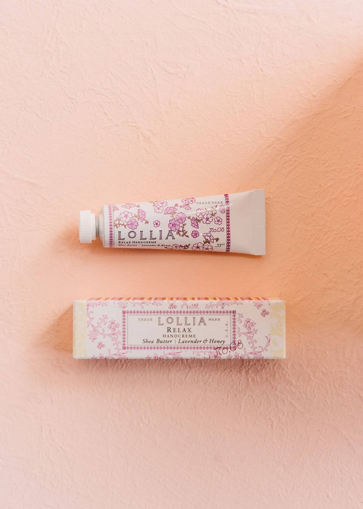 lollia relax handcreme on a pink background