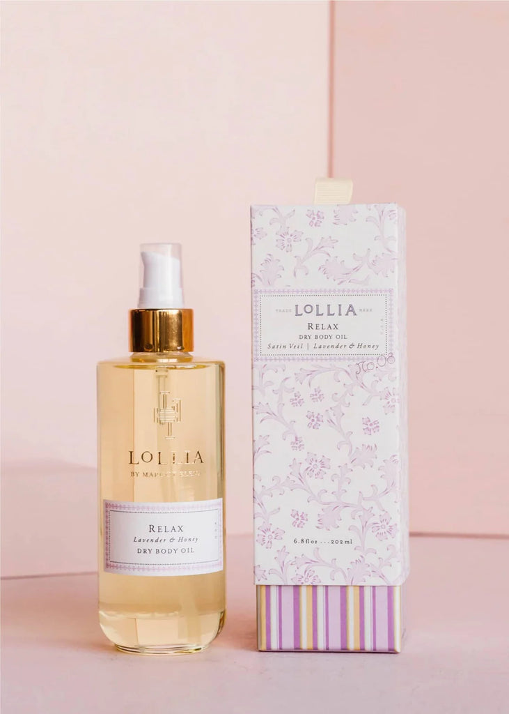 Lollia bottle and packaging on a pink background