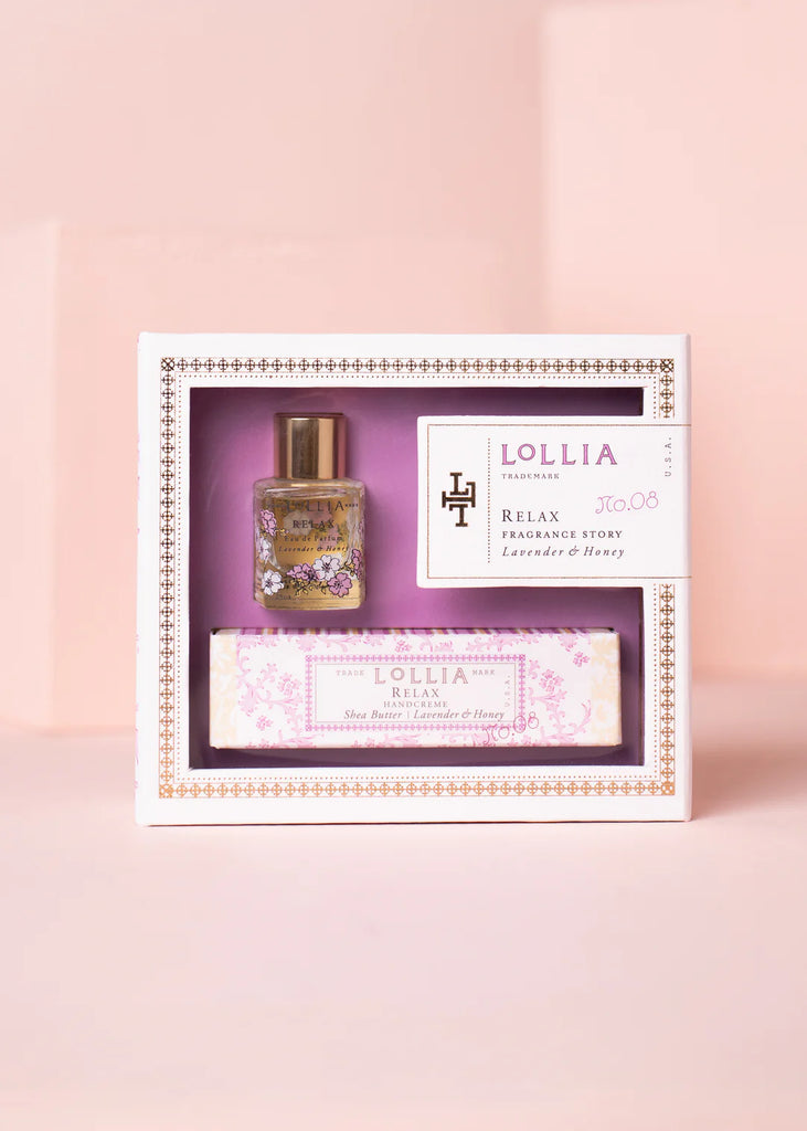 Lollia gift set with a bottle and bar of soap on a pink background